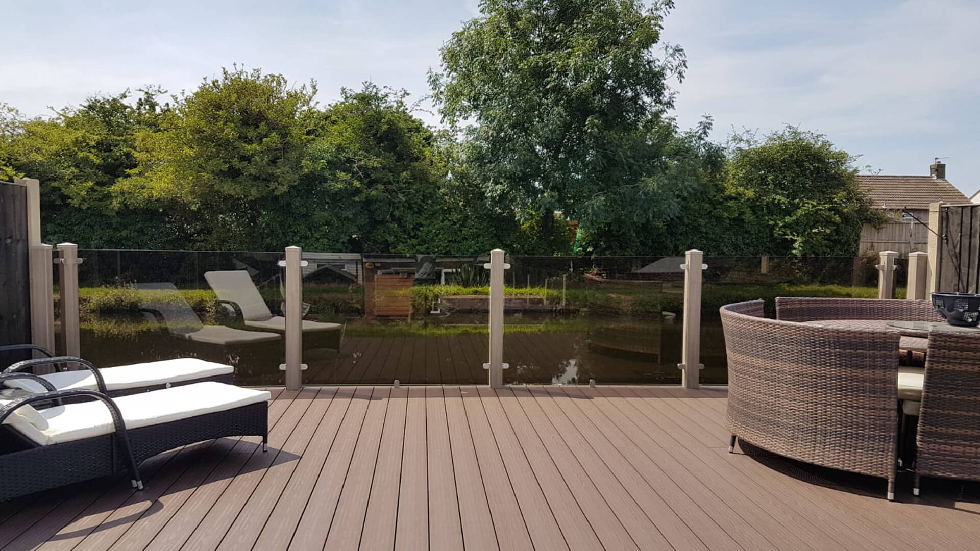 Walnut Decking with Glass Balustrades